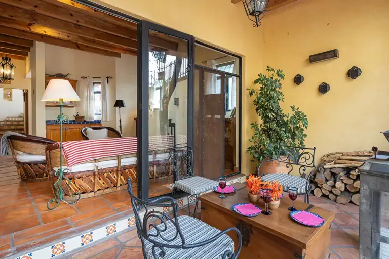 Casa DeeDee, sitting room opening to the courtyard through glass doors, San Miguel de Allende
