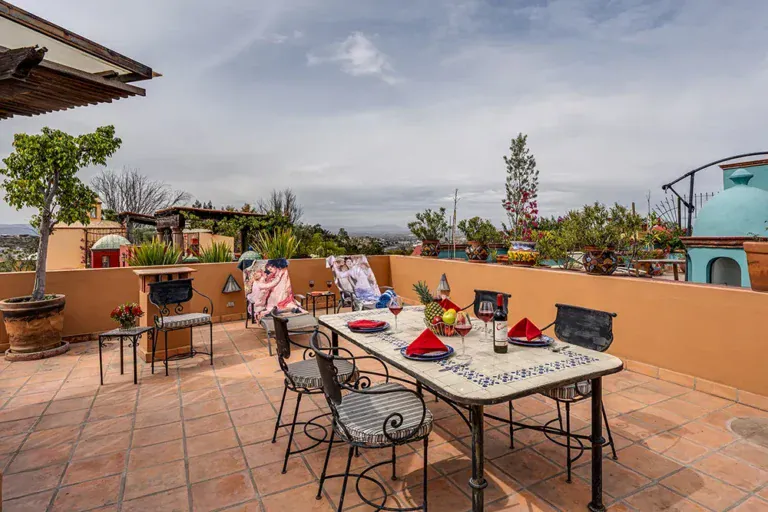 Casa DeeDee, rooftop terrace with a tile table and a view over the town, San Miguel de Allende