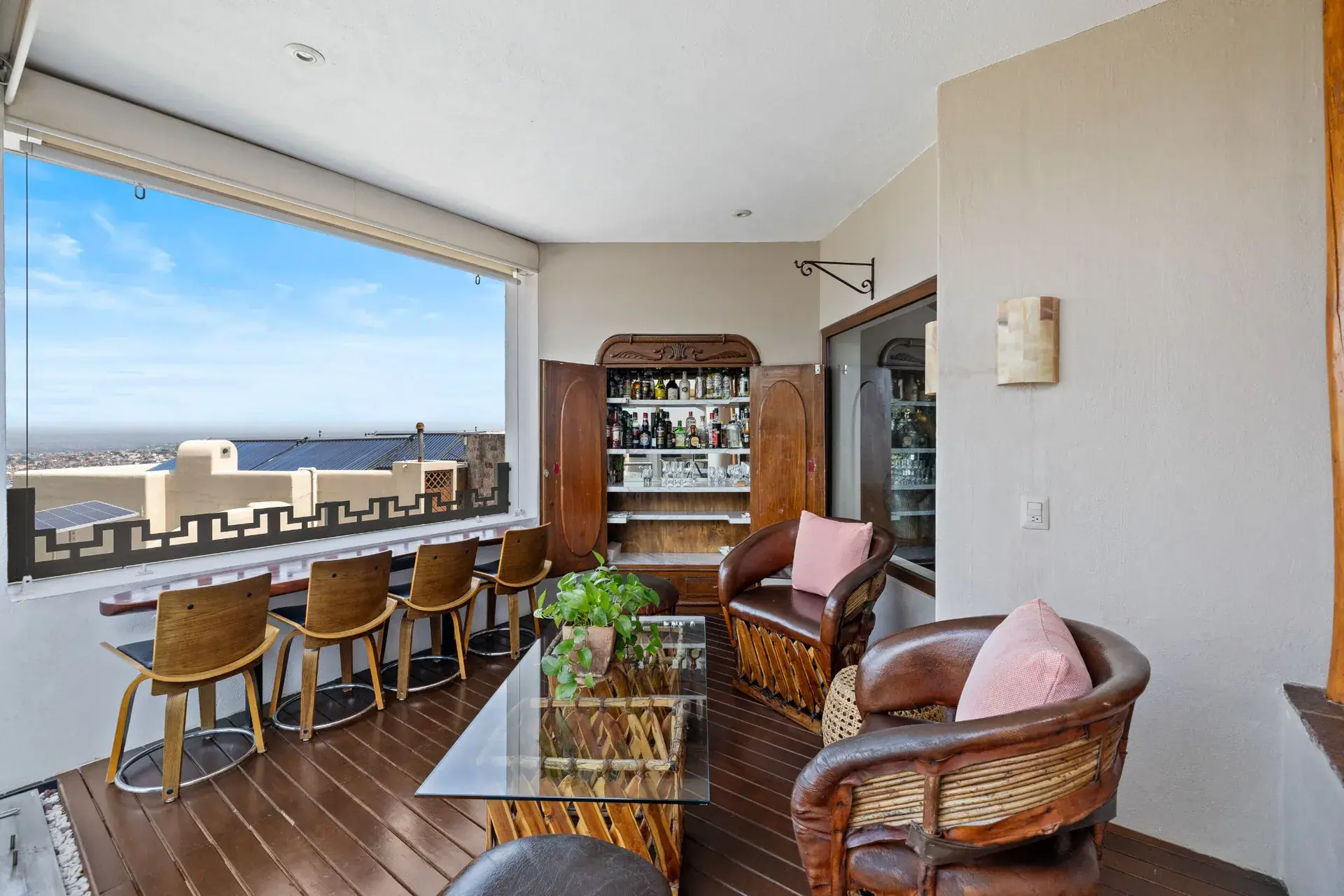 Casa del Foro, covered bar with leather armchairs, a liquor cabinet and a view over the rooftops, San Miguel de Allende