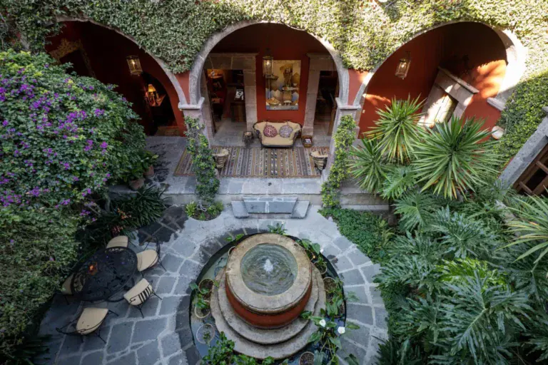 Casa Diana, aerial view of the courtyard fountain surrounded by plants and arches, San Miguel de Allende