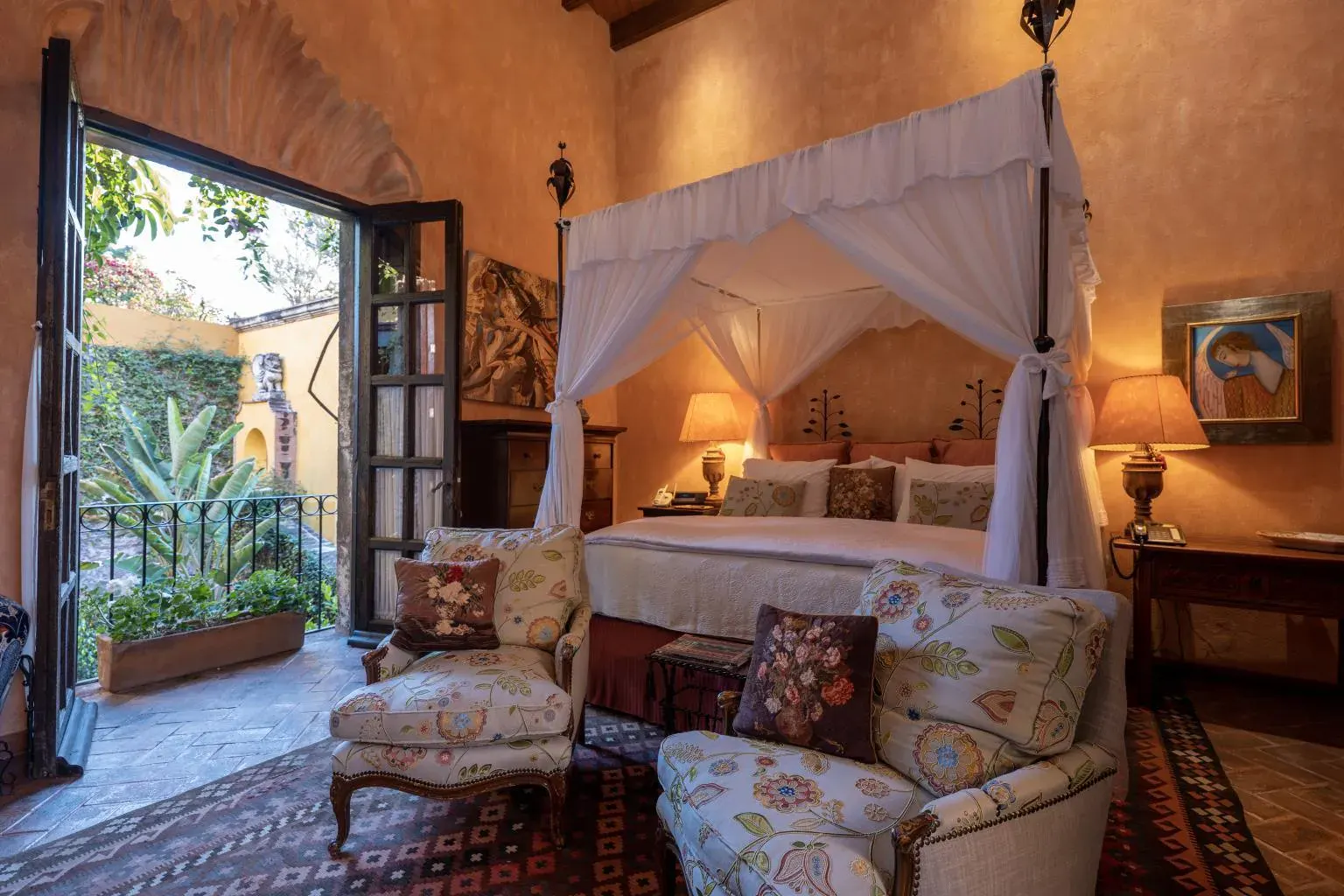 Casa Diana, primary bedroom with a canopy bed and a balcony door, San Miguel de Allende