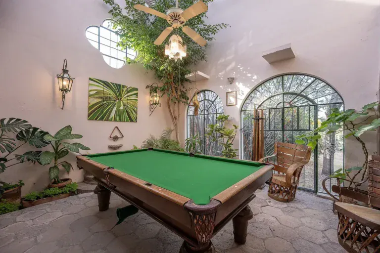 Casa Gracia, garden room with a billiard table and tropical plants, San Miguel de Allende