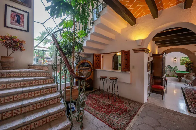 Casa Gracia, staircase with tiled steps and a view into the dining area, San Miguel de Allende