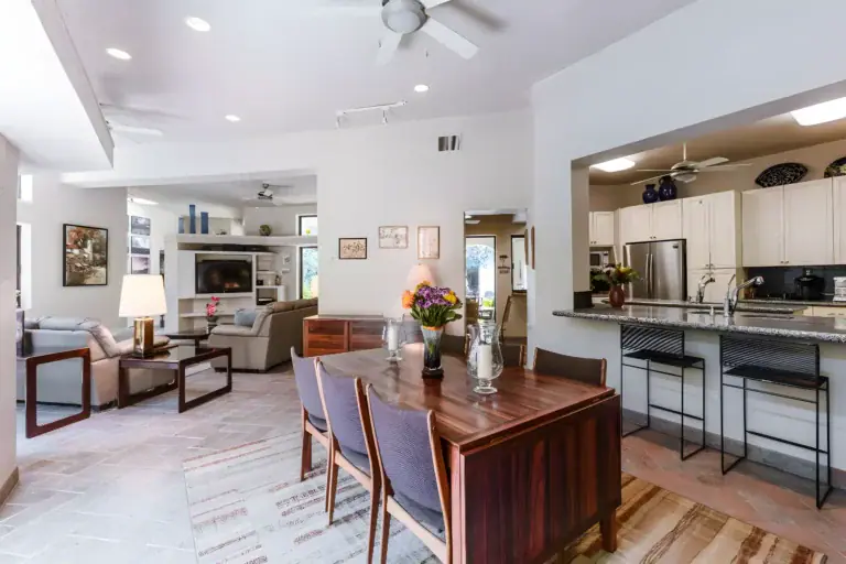 Casa Guadiana, dining area and living room with a kitchen pass-through and built-in shelving, San Miguel de Allende
