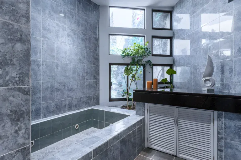 Casa Guadiana, bathroom with a marble soaking tub and tall windows, San Miguel de Allende