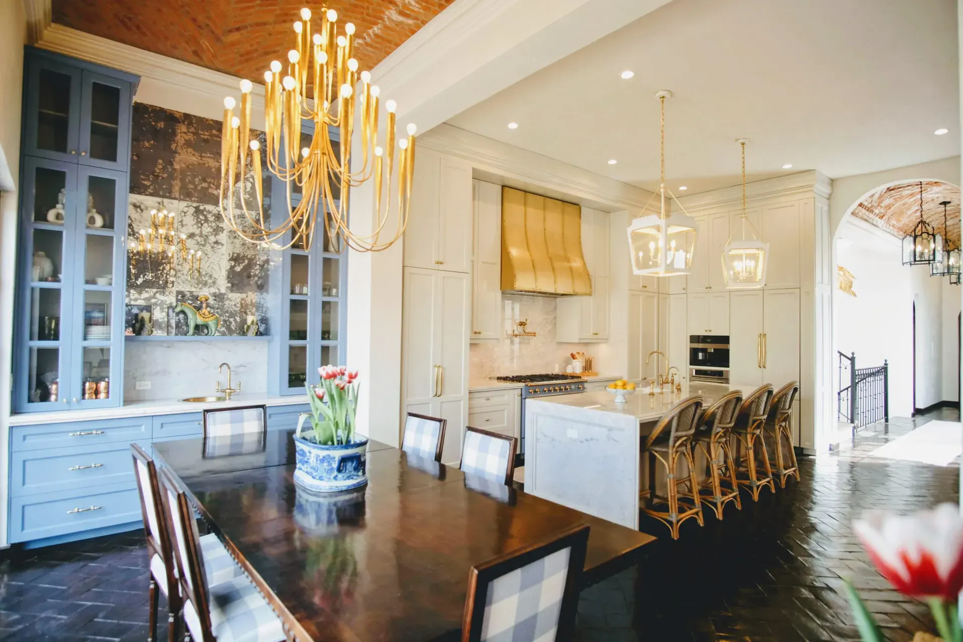 Casa Jacaranda, dining table beside the kitchen with a gold chandelier, San Miguel de Allende