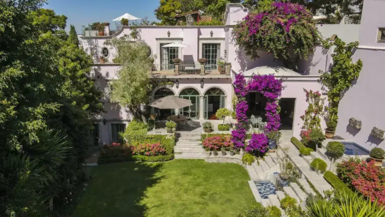 Casa Jardín, pink house above a terraced garden with bougainvillea and a lawn, San Miguel de Allende