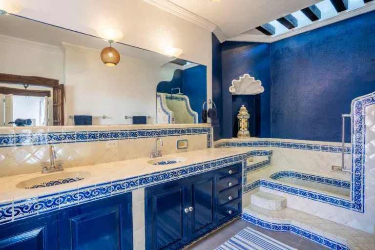 Casa Jardín, bathroom with blue cabinets, talavera tile and a sunken tub, San Miguel de Allende