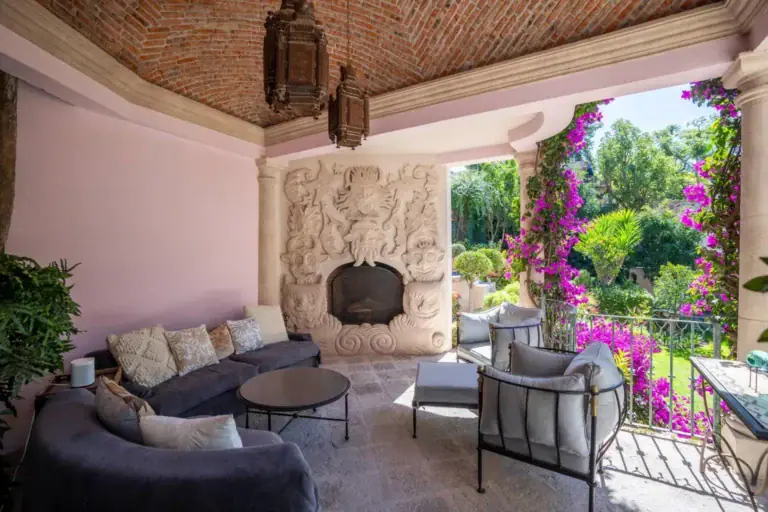 Casa Jardín, covered terrace with a carved stone fireplace and a brick vaulted ceiling, San Miguel de Allende