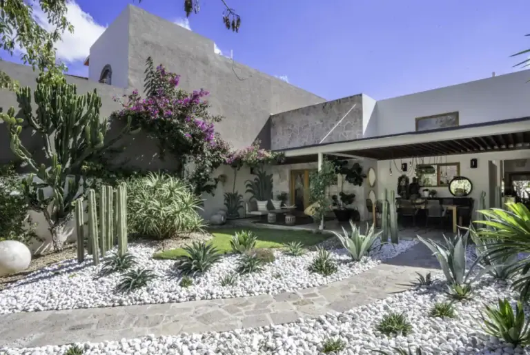 Casa Juan Guadiana, modern garden with cacti, a gravel path and a covered terrace, San Miguel de Allende