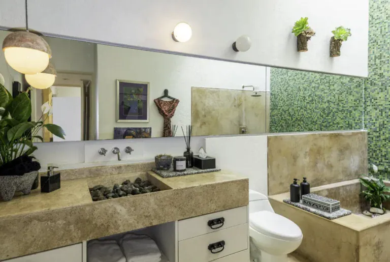 Casa Juan Guadiana, bathroom with a stone sink and green mosaic tile, San Miguel de Allende