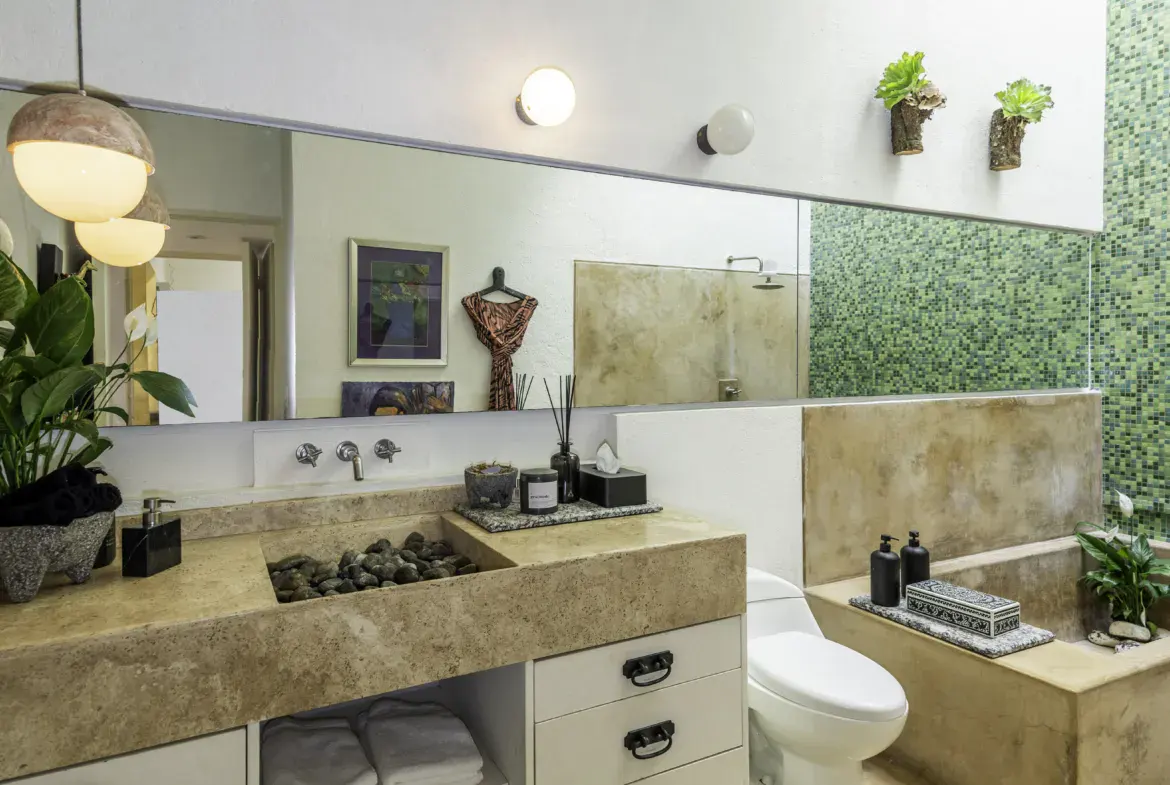 Casa Juan Guadiana, bathroom with a stone sink and green mosaic tile, San Miguel de Allende