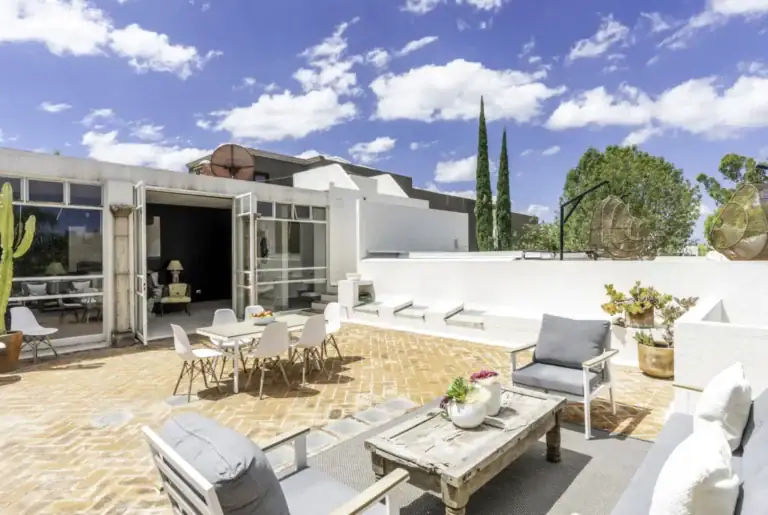 Casa Juan Guadiana, terrace with a patio dining set, outdoor sofas and a view of the sky, San Miguel de Allende