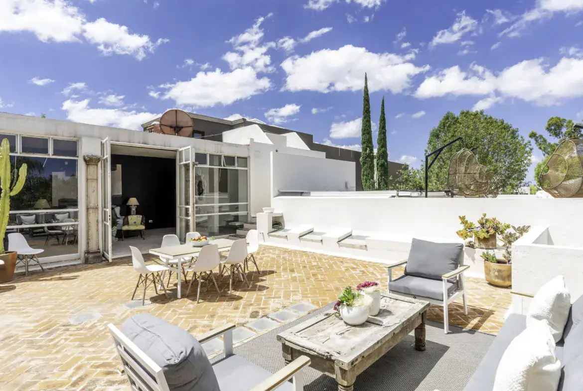 Casa Juan Guadiana, terrace with a patio dining set, outdoor sofas and a view of the sky, San Miguel de Allende