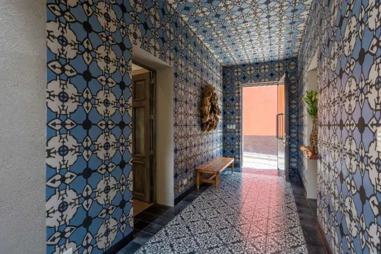 Casa Lily, hallway with blue and white patterned tile on the walls and floor, San Miguel de Allende