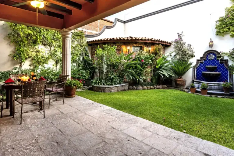 Casa Lua, courtyard garden with a lawn, a blue tile fountain and a covered seating area, San Miguel de Allende