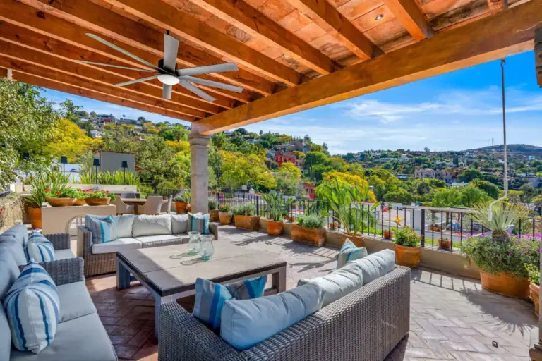 Casa Luz, rooftop terrace with outdoor sofas and views over the hills, San Miguel de Allende