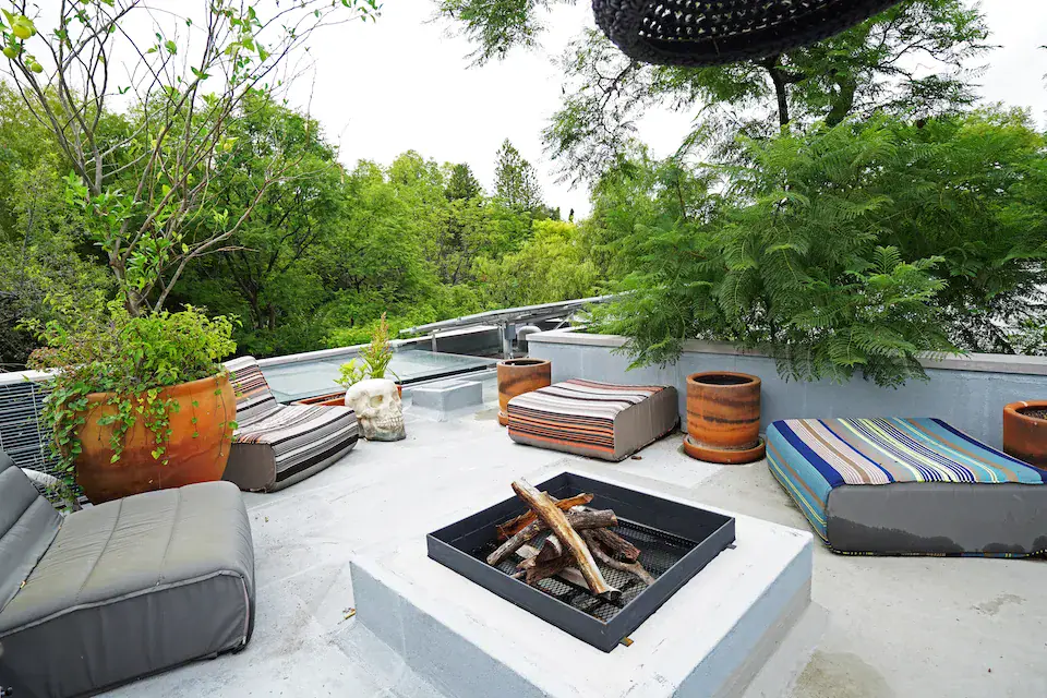 Casa Mojica, rooftop terrace with a fire pit and a view of the treetops, San Miguel de Allende
