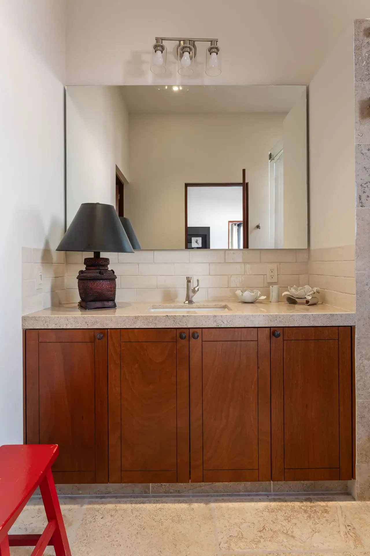 Casa Nobel, powder room with a wood vanity and a mirror, San Miguel de Allende