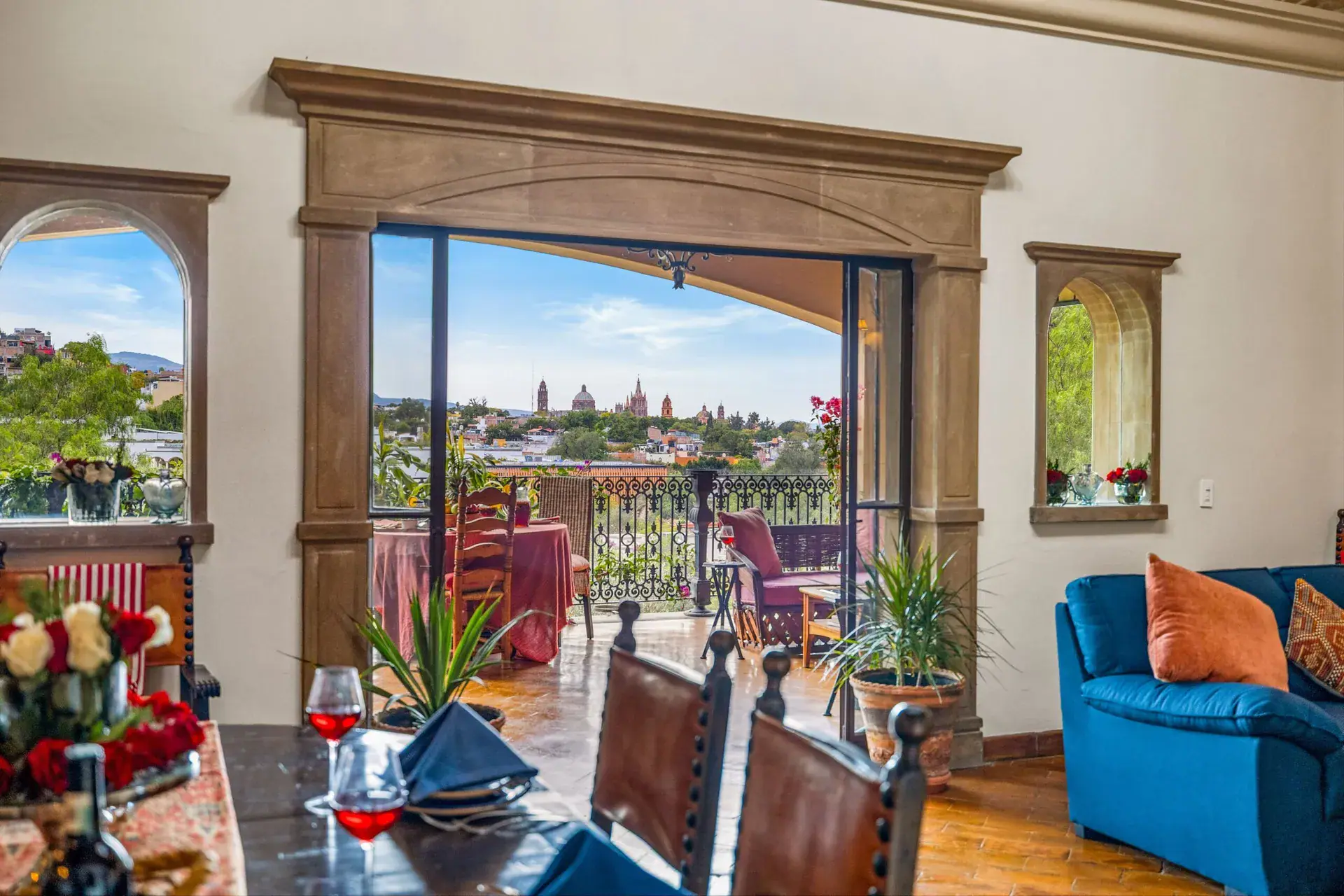 Casa Noche Magica, terrace doors framed in stone with a view over town from the dining table, San Miguel de Allende