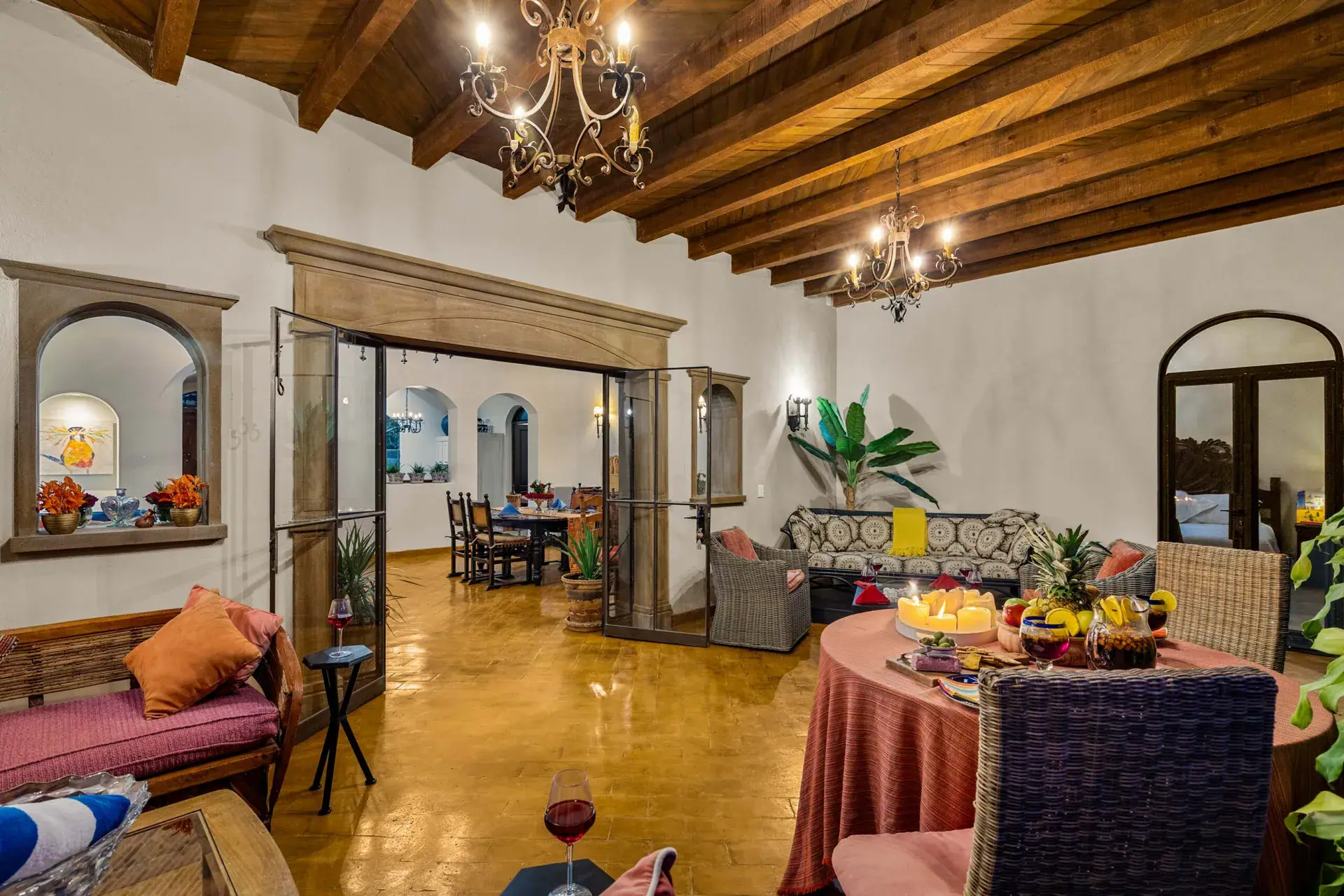 Casa Noche Magica, upper-level living space with a stone-framed double door and a view to a dining area, San Miguel de Allende