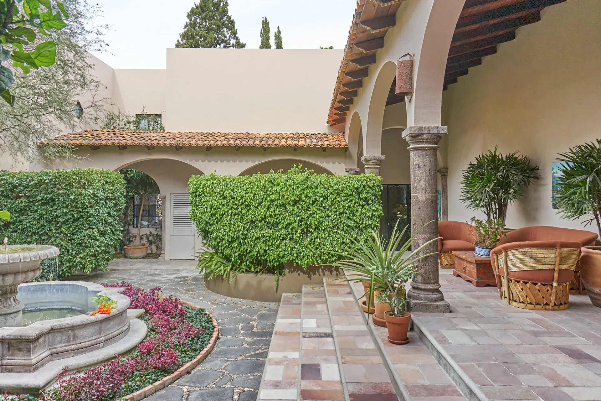 Casa Oasis, arcaded loggia with a slate path leading to a courtyard, San Miguel de Allende