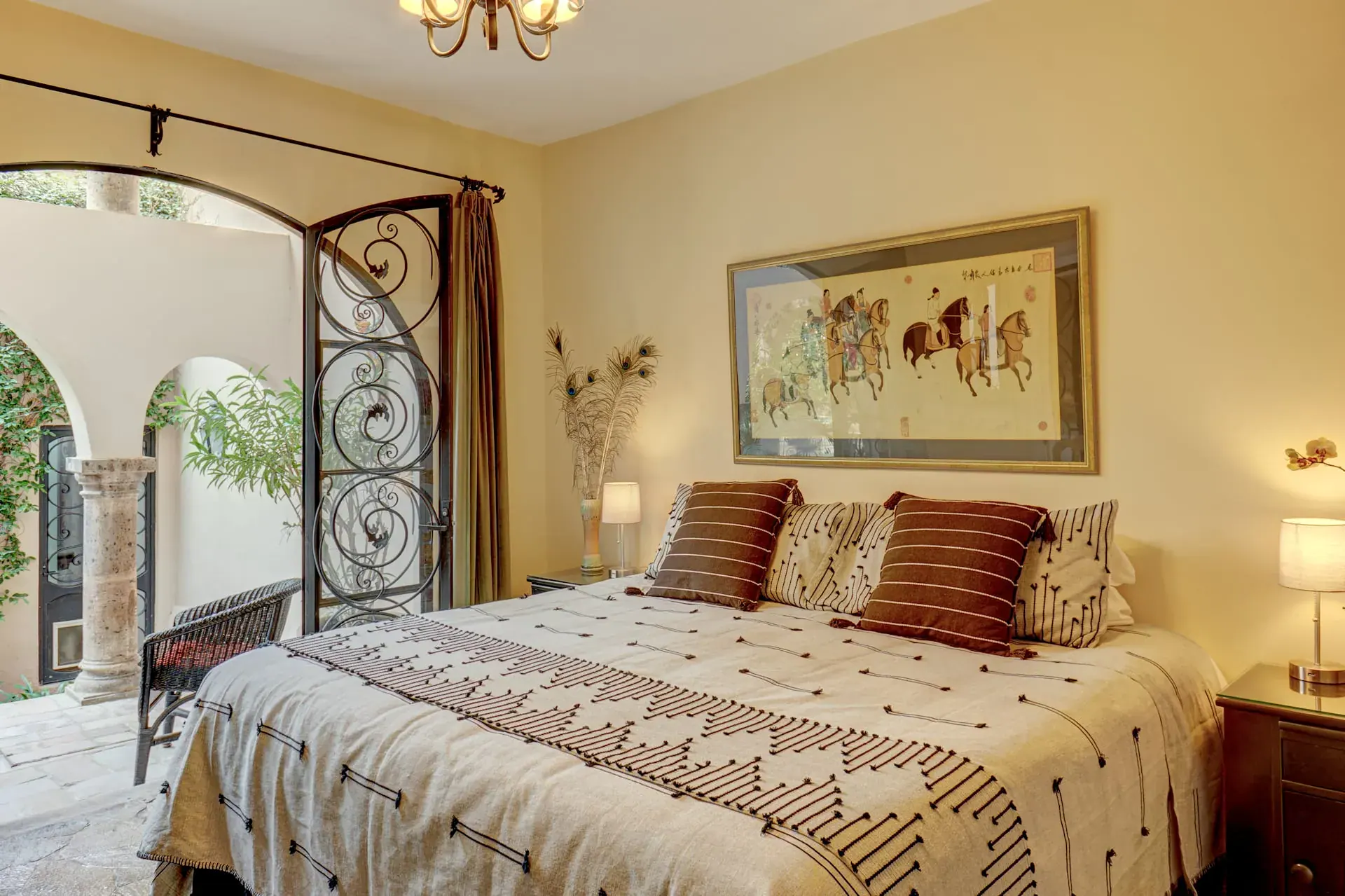 Casa Oasis, bedroom with wrought-iron doors opening to the courtyard, San Miguel de Allende