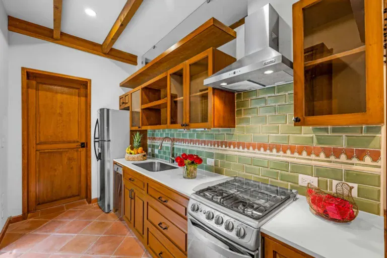 Casa Paradise, kitchen with a green tile backsplash and a gas range, San Miguel de Allende