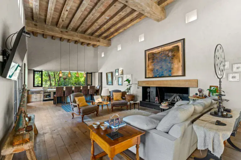 Casa Paz, living and dining area with a long beamed ceiling and garden views, San Miguel de Allende