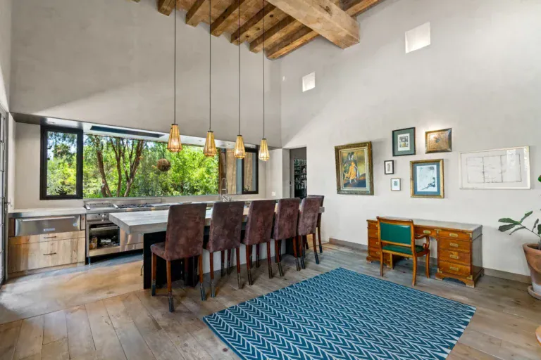Casa Paz, kitchen with a long concrete island and dark wood bar stools, San Miguel de Allende
