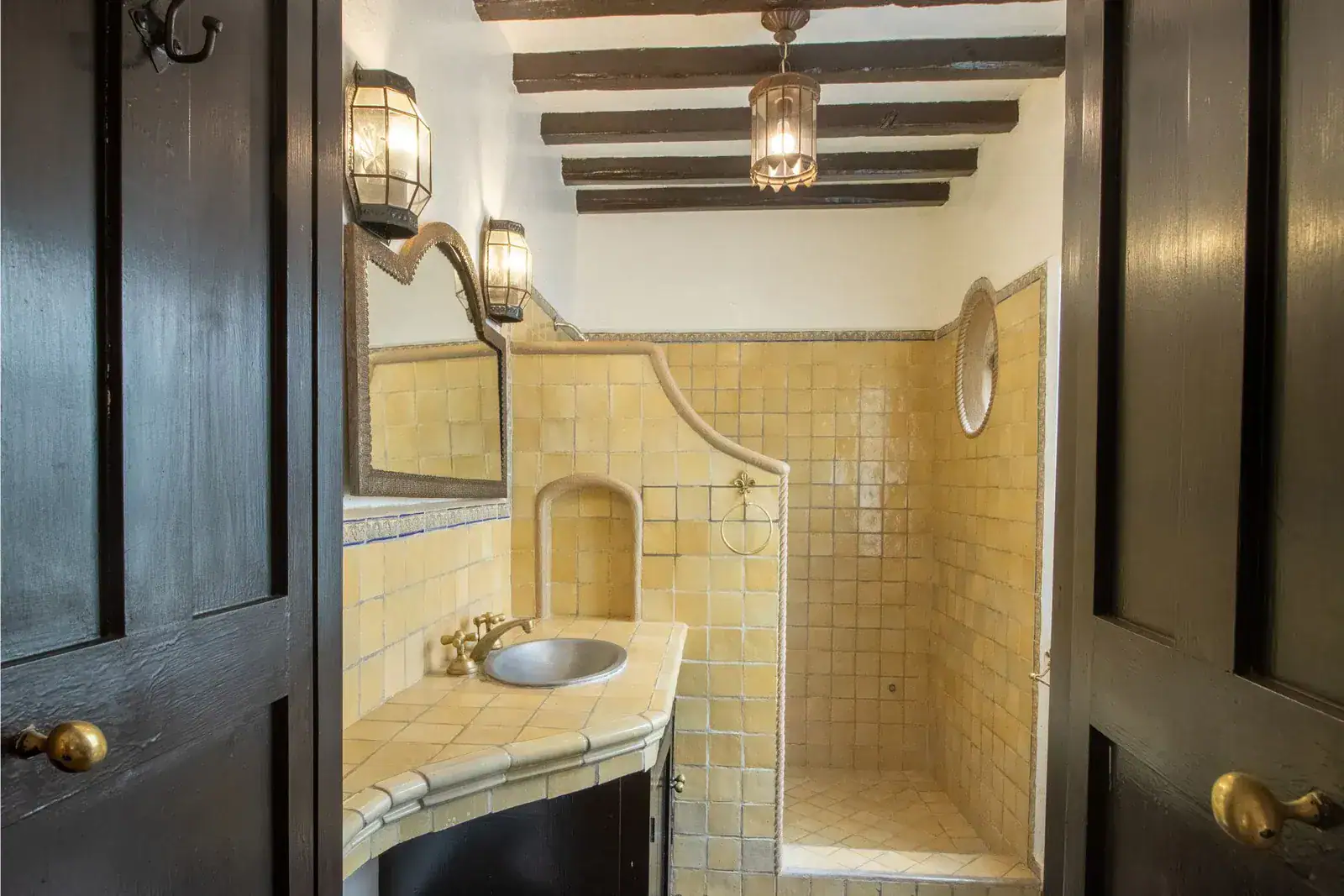 Casa Quetzal Hotel, bathroom with a yellow tile shower, vanity and a beamed ceiling, San Miguel de Allende
