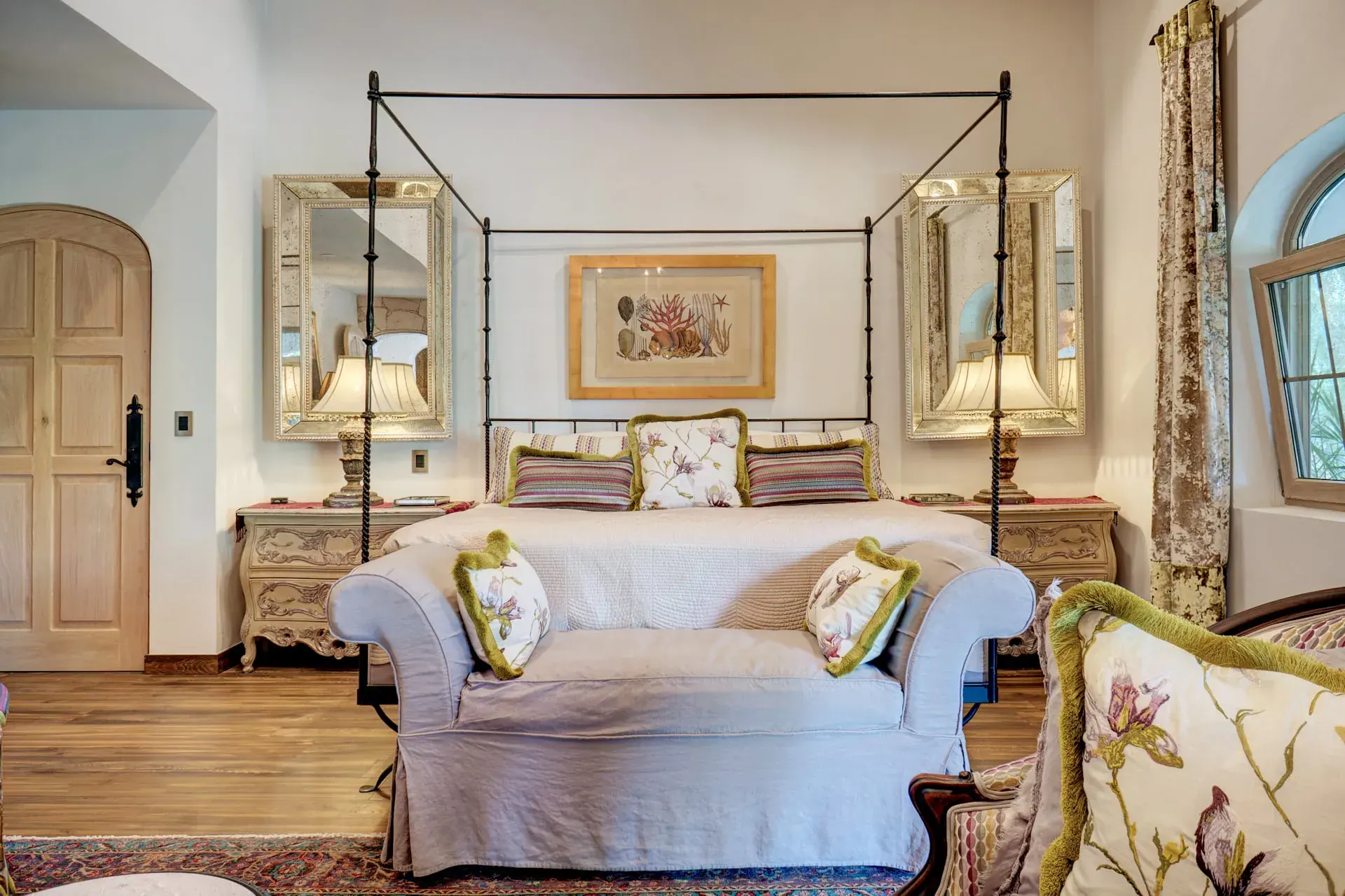 Casa Rosa, primary bedroom with a canopy bed and a white sofa, San Miguel de Allende