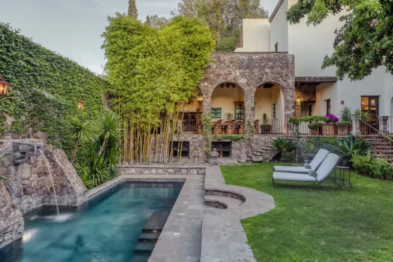 Casa San Jose, stone house with arched loggia above a lap pool and lawn, San Miguel de Allende