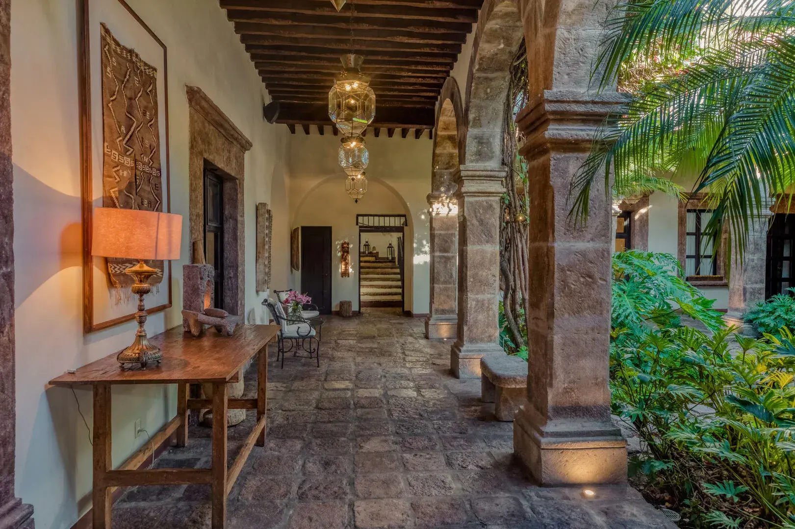 Casa San Jose, stone arcade with wood beams and a console table, San Miguel de Allende