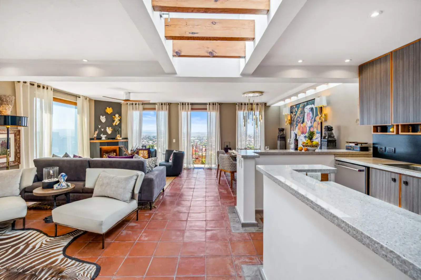 Casa San Rafael, open living room and kitchen with large windows to the view, San Miguel de Allende