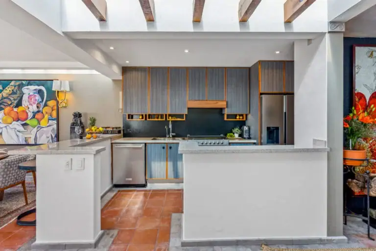 Casa San Rafael, kitchen with gray cabinets, a white counter and a gas cooktop, San Miguel de Allende