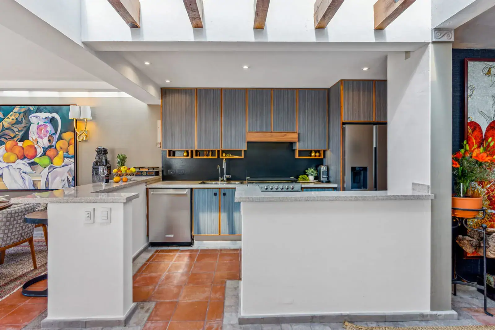 Casa San Rafael, kitchen with gray cabinets, a white counter and a gas cooktop, San Miguel de Allende