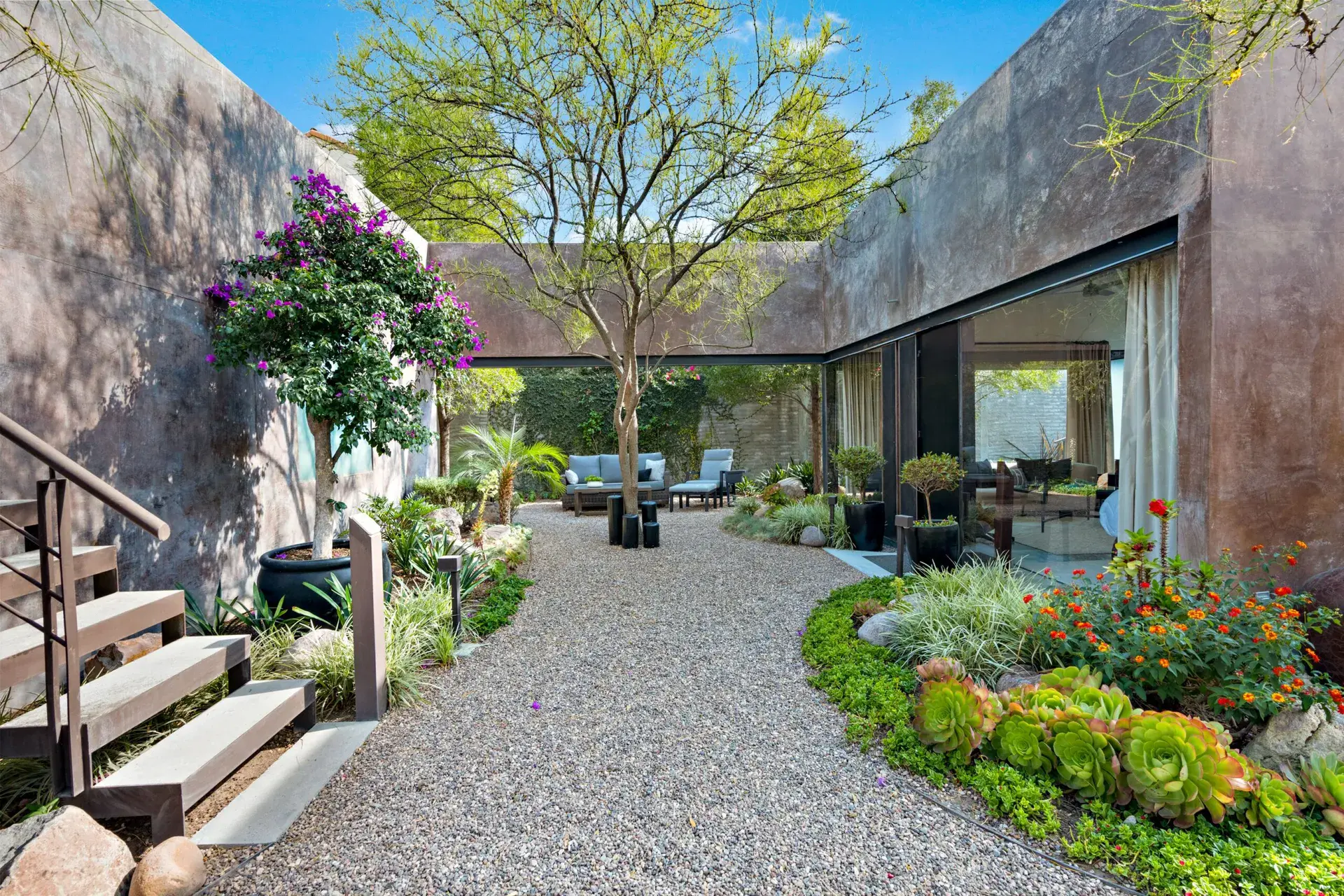Casa Sanchez Renero, garden path with succulents, bougainvillea and a floating steel staircase, San Miguel de Allende