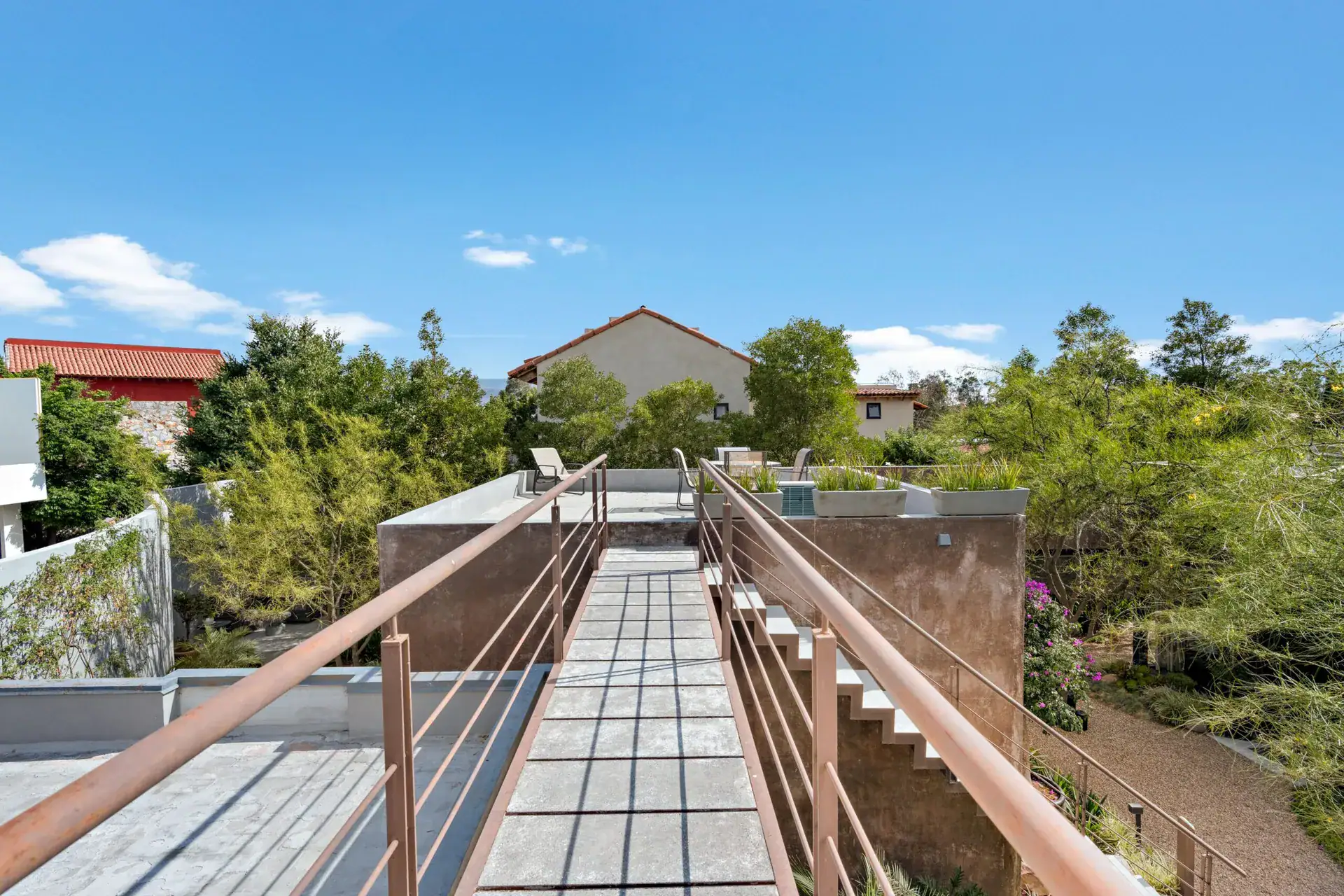 Casa Sanchez Renero, rooftop catwalk with steel cable railings leading to the roof terrace, San Miguel de Allende
