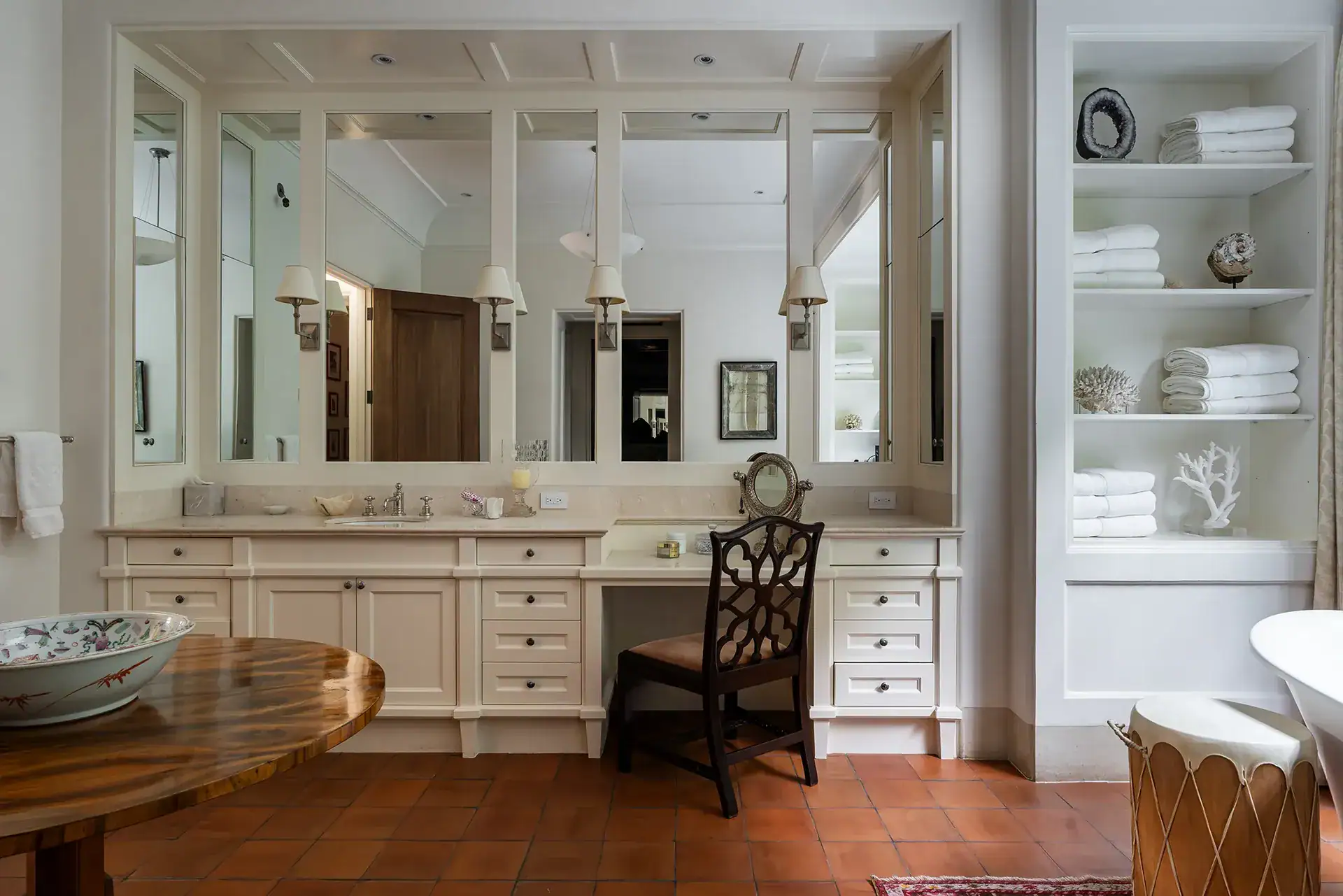 Casa Sienna, bathroom dressing area with a built-in vanity and shelves of towels, San Miguel de Allende