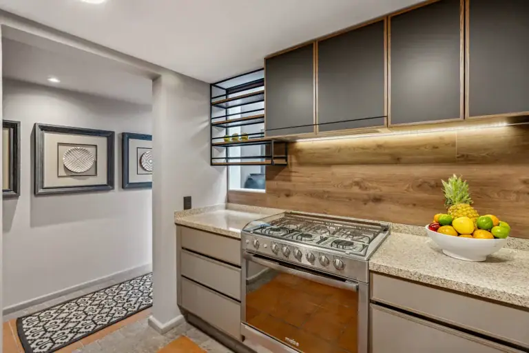 Casa Tequila, kitchen with gray cabinets and a gas range, San Miguel de Allende