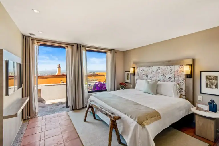Casa Tequila, primary bedroom with a floral headboard and a terrace view, San Miguel de Allende