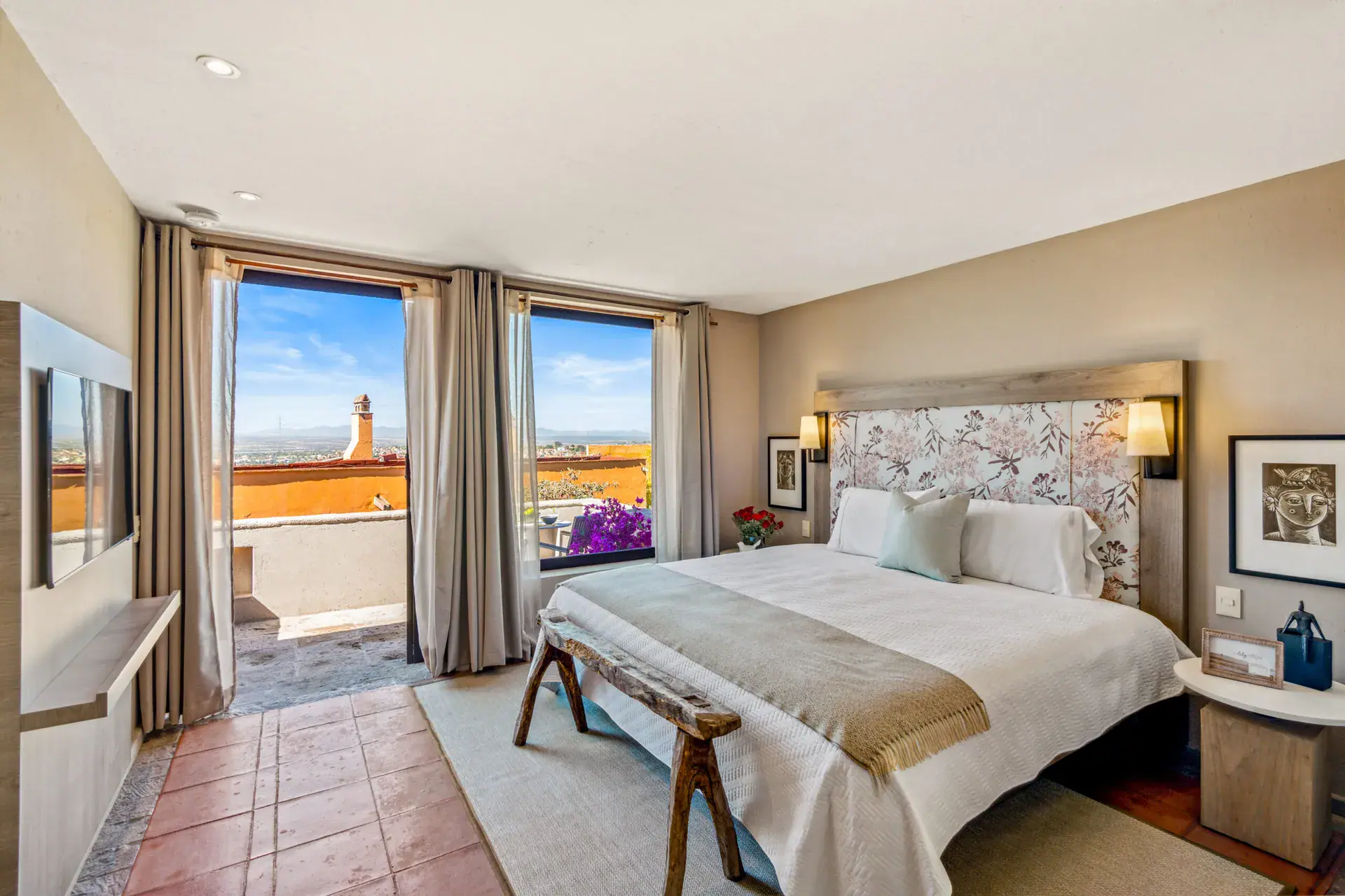 Casa Tequila, primary bedroom with a floral headboard and a terrace view, San Miguel de Allende
