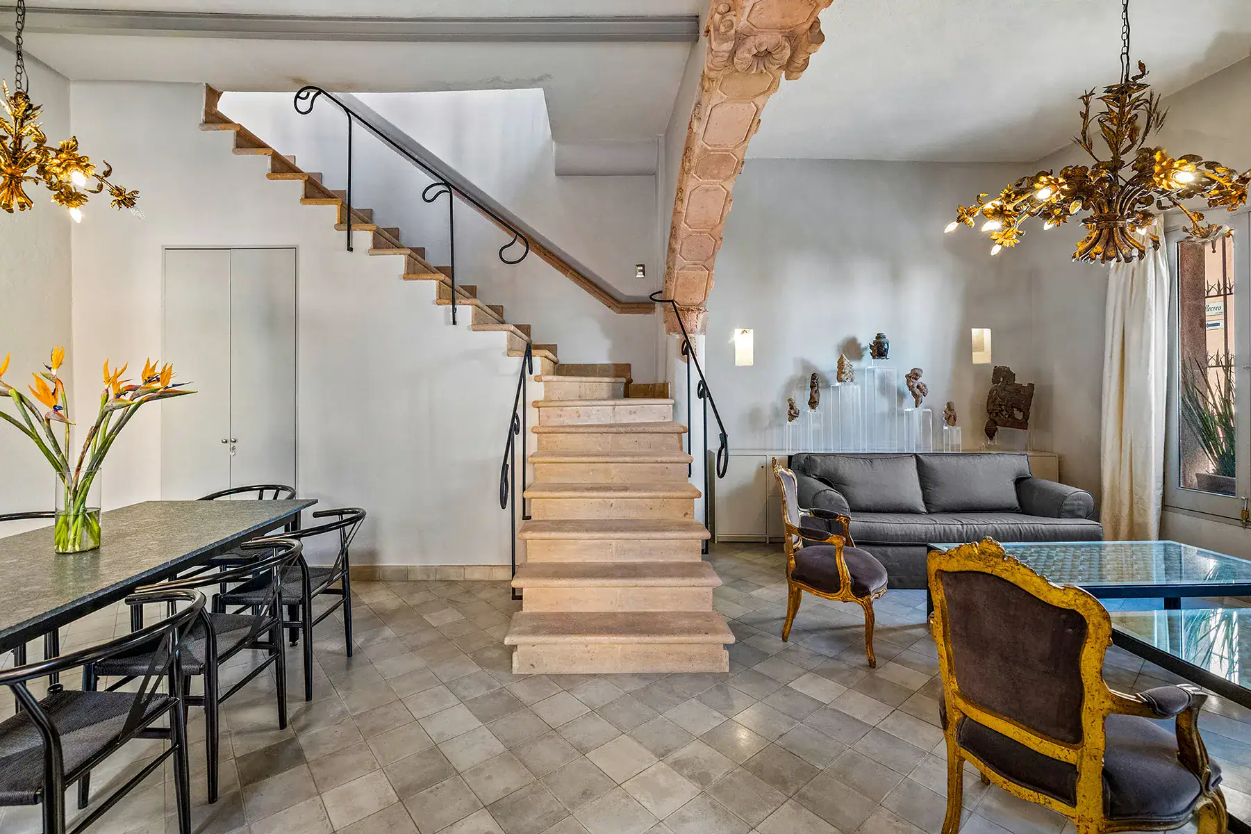 Casa White Magnolias, dining table, stone staircase and sitting area with antique armchairs, San Miguel de Allende