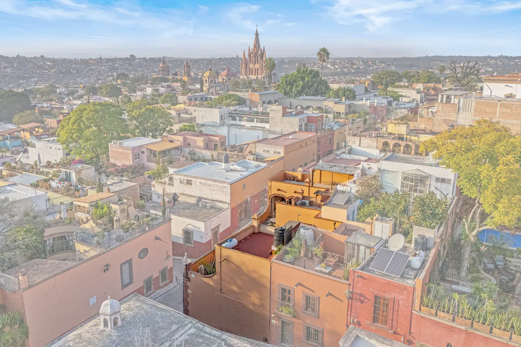 Casa White Magnolias, aerial view of the rooftops with the Parroquia in the distance, San Miguel de Allende