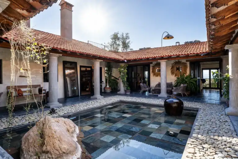 Casa Zen, courtyard with a reflecting pool of slate tiles under a tile roof, San Miguel de Allende