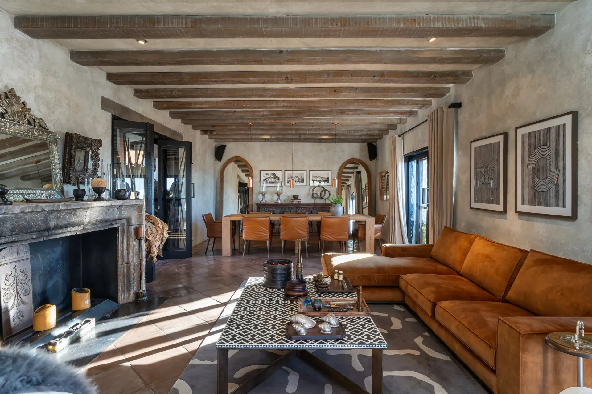 Casa Zen, open living and dining room with a long beamed ceiling and a fireplace, San Miguel de Allende