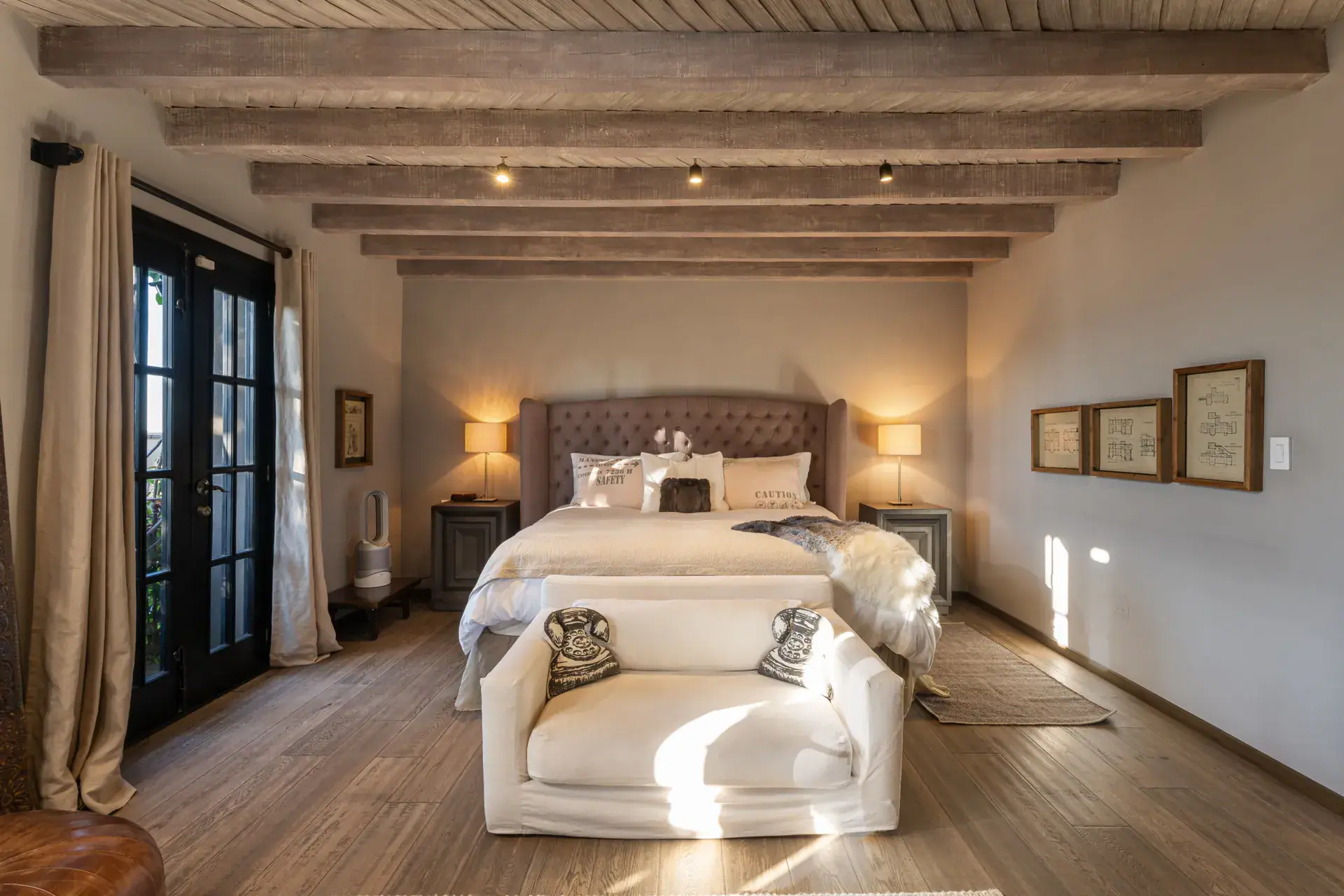 Casa Zen, bedroom with an upholstered headboard and French doors, San Miguel de Allende