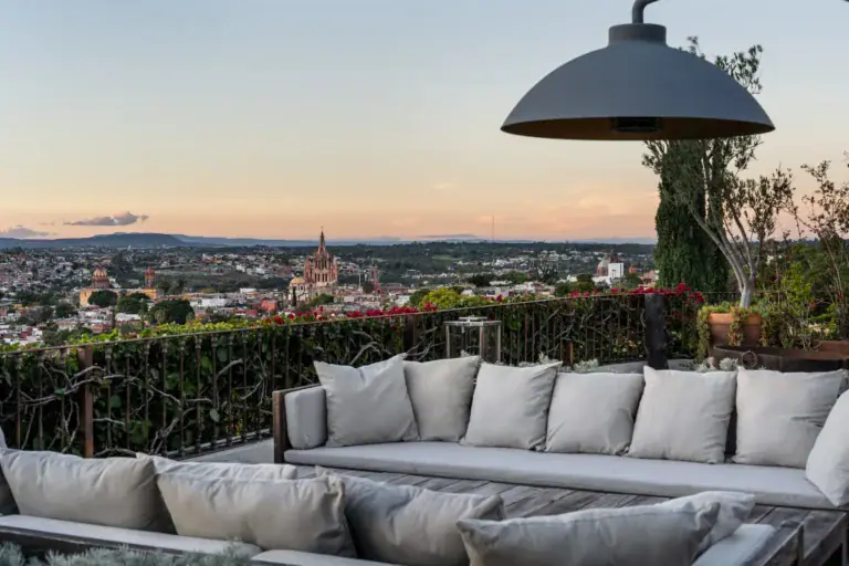 Casa Zen, terrace sofa overlooking the Parroquia and the city at sunset, San Miguel de Allende