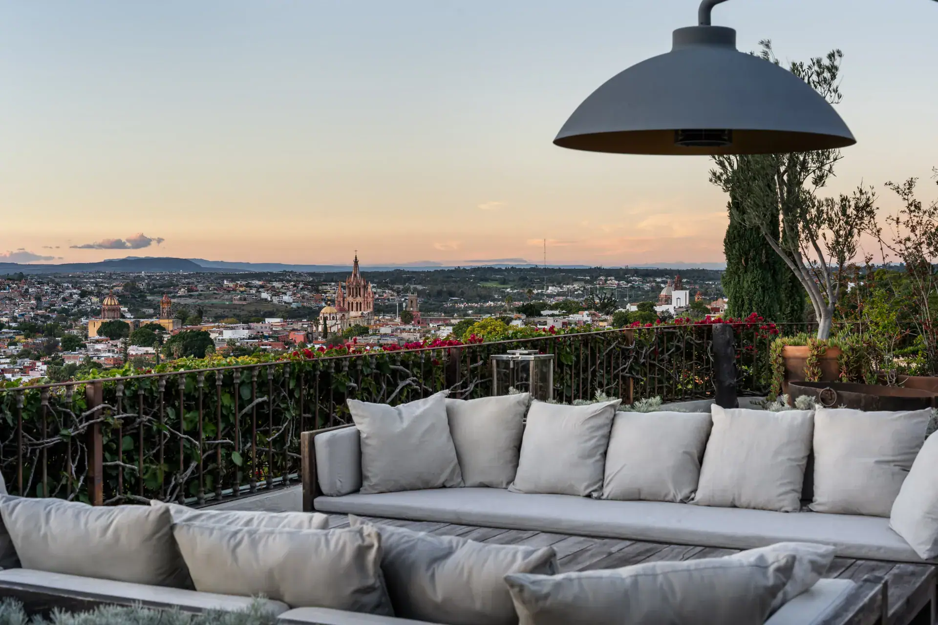 Casa Zen, terrace sofa overlooking the Parroquia and the city at sunset, San Miguel de Allende